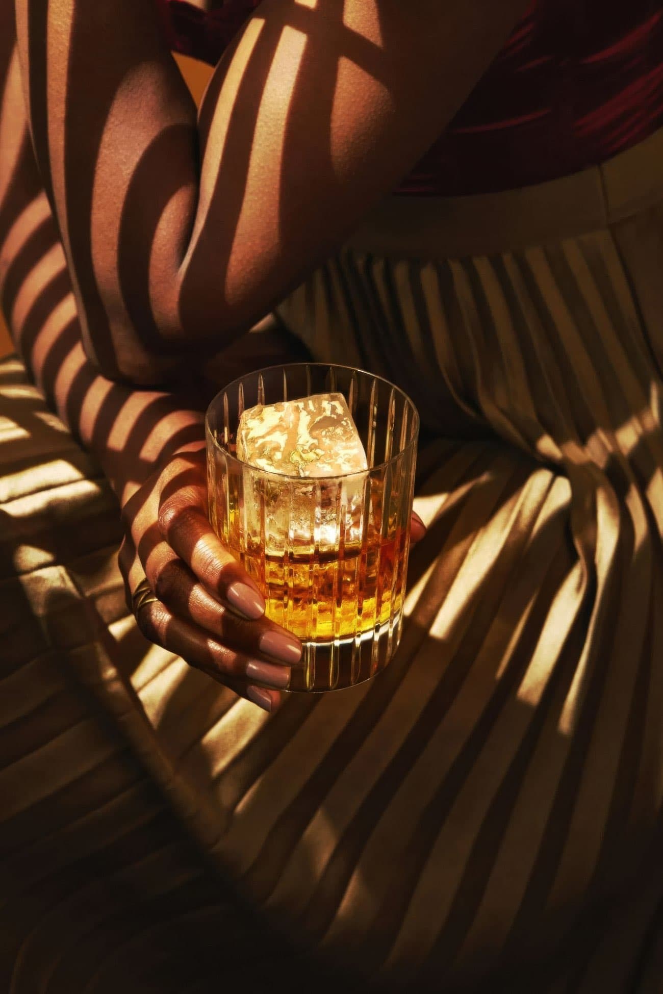 Whiskey glass in dramatic light